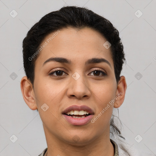 Joyful latino young-adult female with short  brown hair and brown eyes