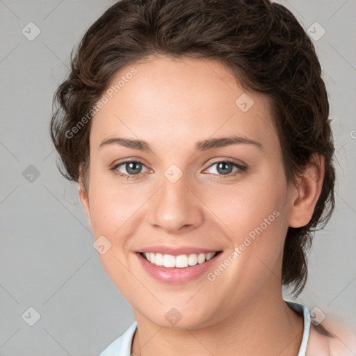 Joyful white young-adult female with medium  brown hair and blue eyes