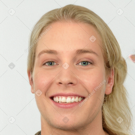 Joyful white young-adult female with long  brown hair and blue eyes