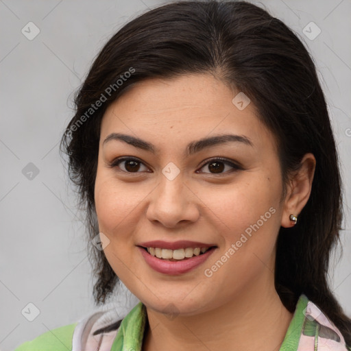 Joyful latino young-adult female with medium  brown hair and brown eyes