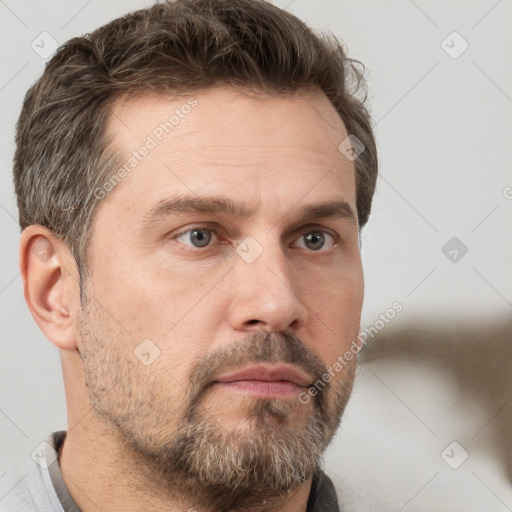 Neutral white adult male with short  brown hair and brown eyes