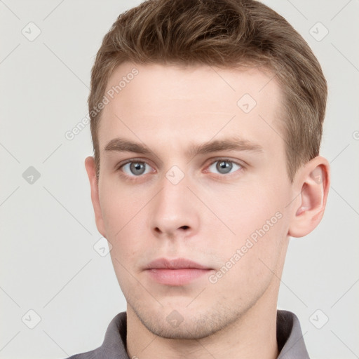 Neutral white young-adult male with short  brown hair and grey eyes