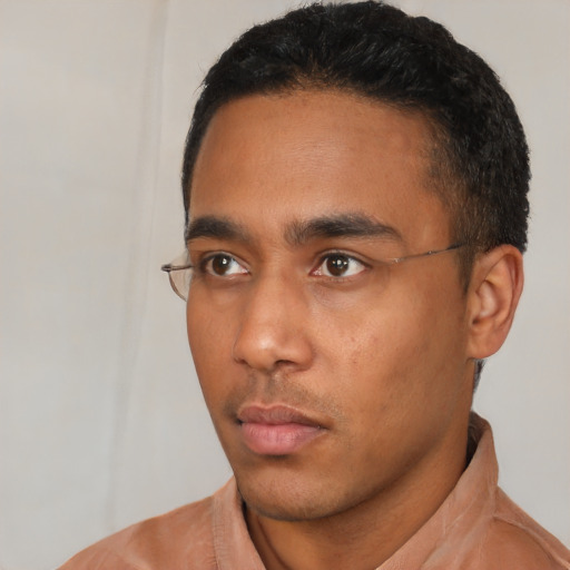 Neutral black young-adult male with short  black hair and brown eyes