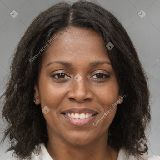 Joyful black young-adult female with medium  brown hair and brown eyes