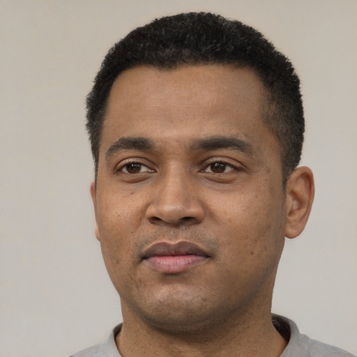 Neutral black young-adult male with short  black hair and brown eyes