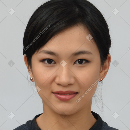 Joyful asian young-adult female with medium  black hair and brown eyes