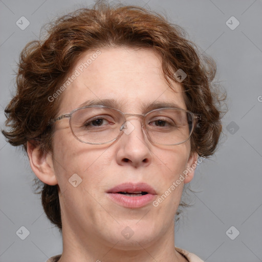 Joyful white adult female with medium  brown hair and blue eyes