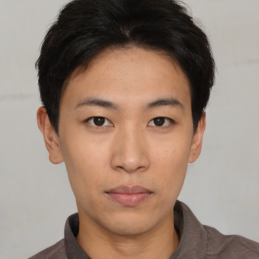 Neutral asian young-adult male with short  brown hair and brown eyes