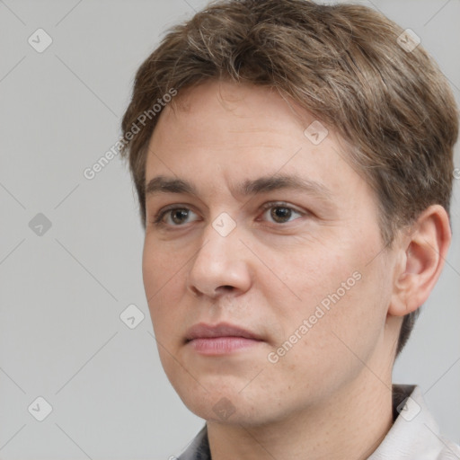 Neutral white adult male with short  brown hair and brown eyes