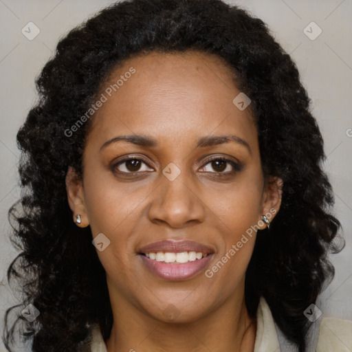 Joyful black young-adult female with long  brown hair and brown eyes