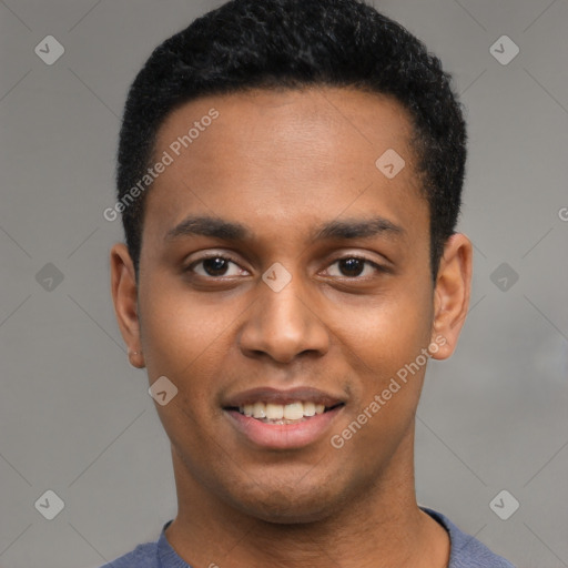 Joyful black young-adult male with short  black hair and brown eyes