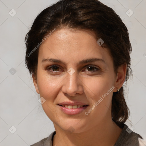 Joyful white adult female with medium  brown hair and brown eyes