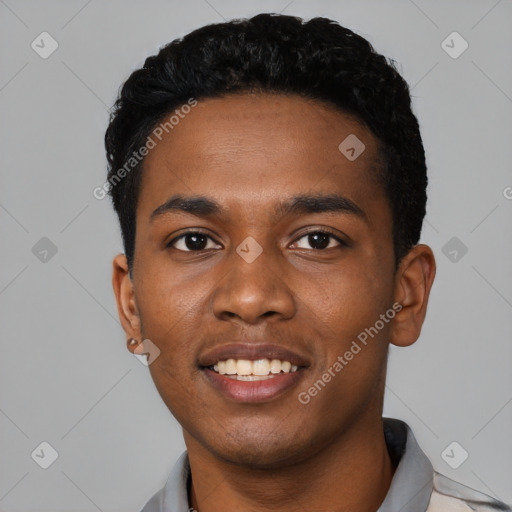 Joyful black young-adult male with short  black hair and brown eyes