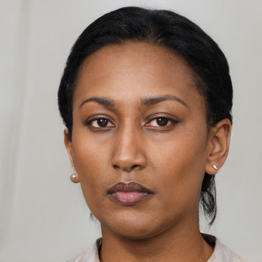 Neutral black young-adult female with short  black hair and brown eyes