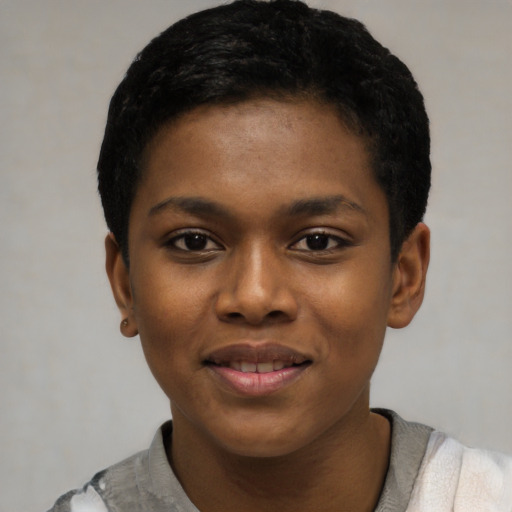Joyful black young-adult female with short  black hair and brown eyes