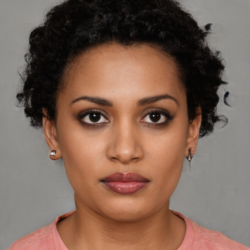 Neutral black young-adult female with short  brown hair and brown eyes