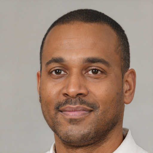 Neutral black adult male with short  black hair and brown eyes