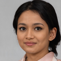 Joyful asian young-adult female with medium  black hair and brown eyes