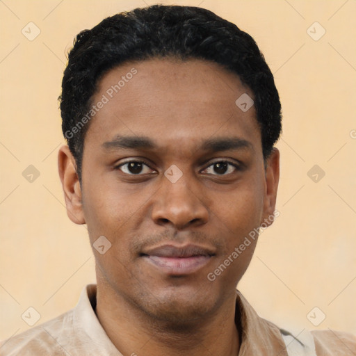 Joyful black young-adult male with short  black hair and brown eyes