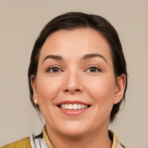 Joyful white young-adult female with medium  brown hair and brown eyes