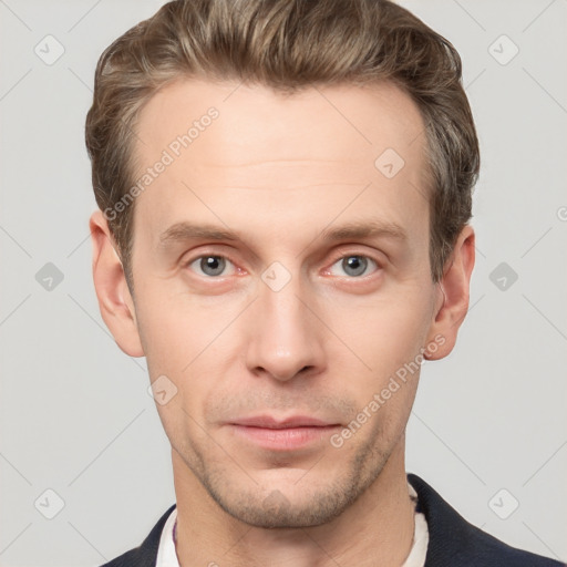 Joyful white young-adult male with short  brown hair and grey eyes