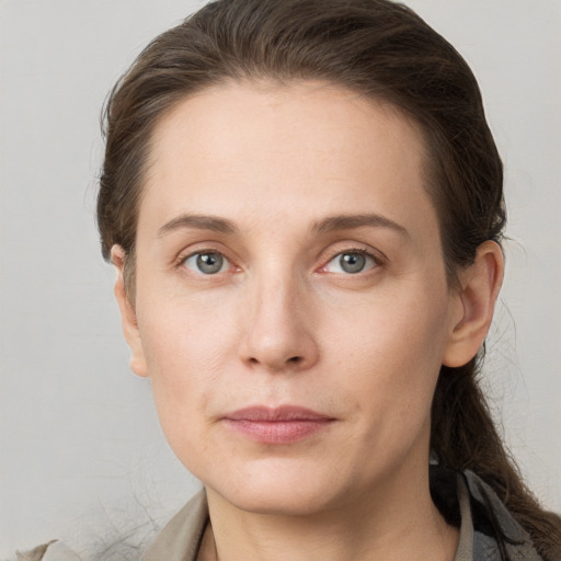 Neutral white young-adult female with long  brown hair and grey eyes