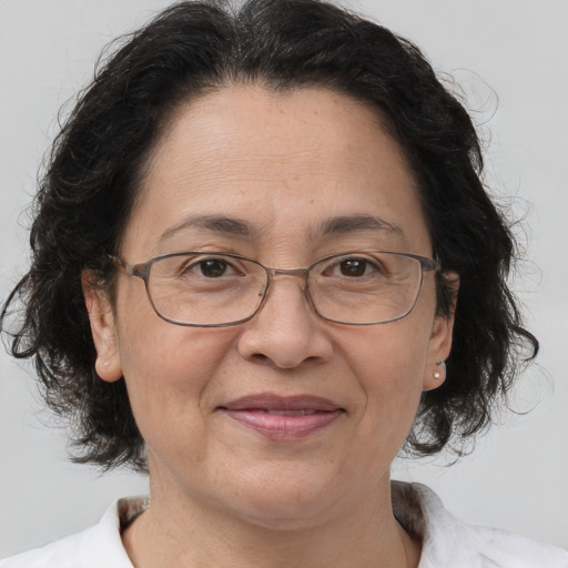 Joyful white middle-aged female with medium  brown hair and brown eyes