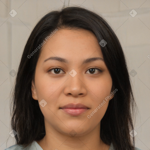 Joyful latino young-adult female with long  brown hair and brown eyes