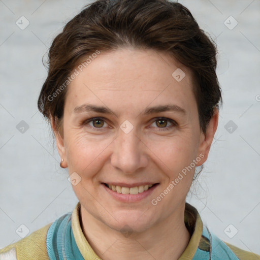 Joyful white adult female with short  brown hair and grey eyes