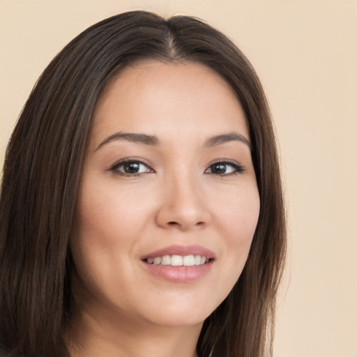 Joyful white young-adult female with long  brown hair and brown eyes