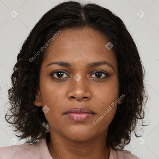 Neutral black young-adult female with medium  brown hair and brown eyes