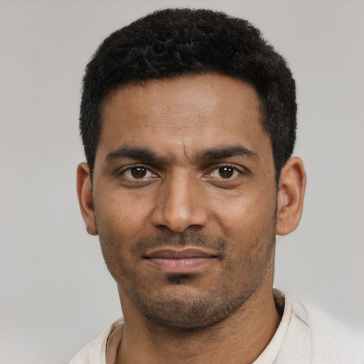 Neutral black young-adult male with short  black hair and brown eyes