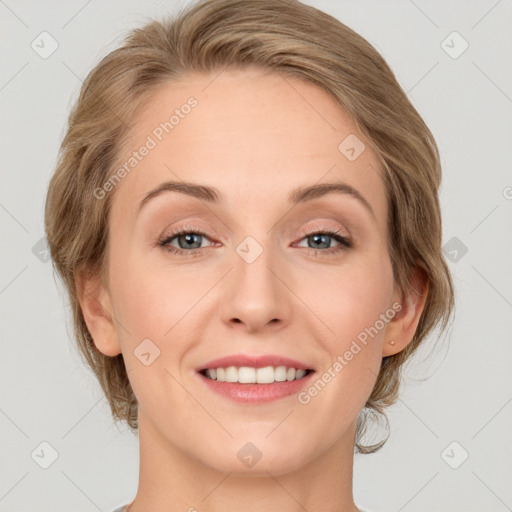 Joyful white young-adult female with medium  brown hair and green eyes