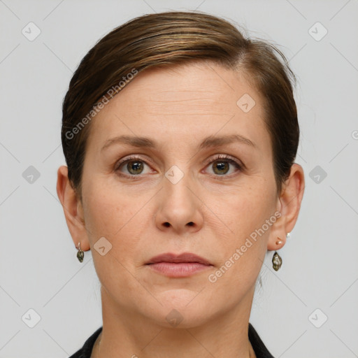 Joyful white adult female with short  brown hair and grey eyes