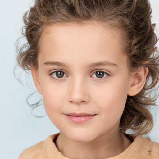 Joyful white child female with medium  brown hair and brown eyes