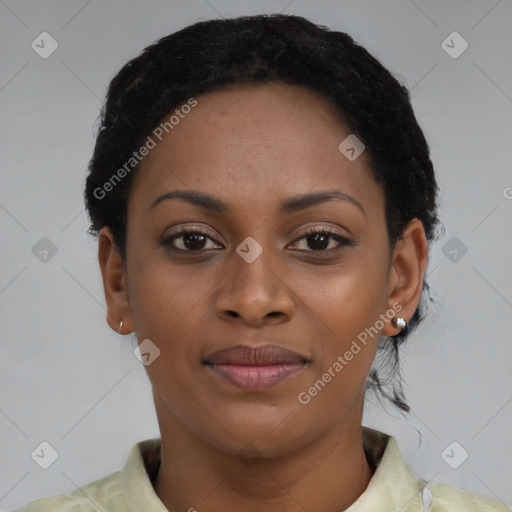 Joyful black young-adult female with short  black hair and brown eyes