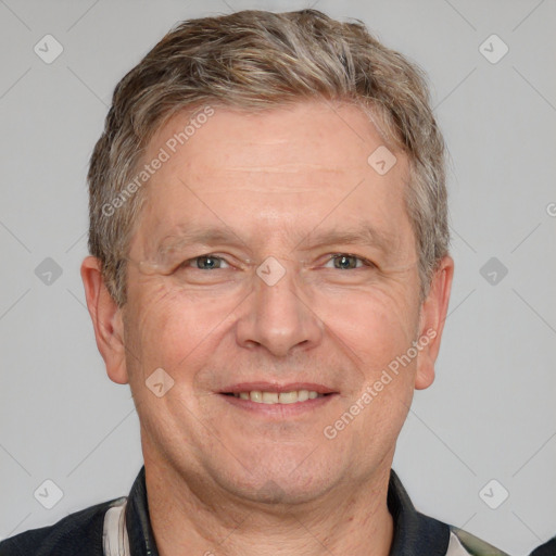 Joyful white adult male with short  brown hair and grey eyes