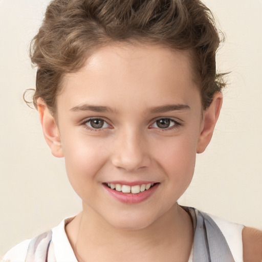 Joyful white child female with short  brown hair and brown eyes