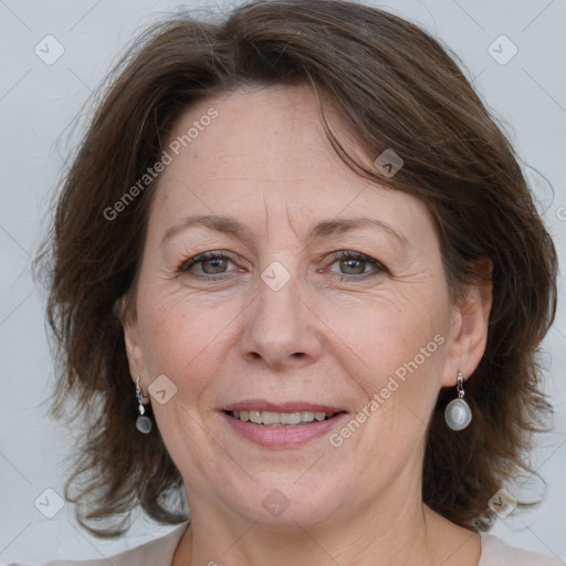 Joyful white adult female with medium  brown hair and grey eyes