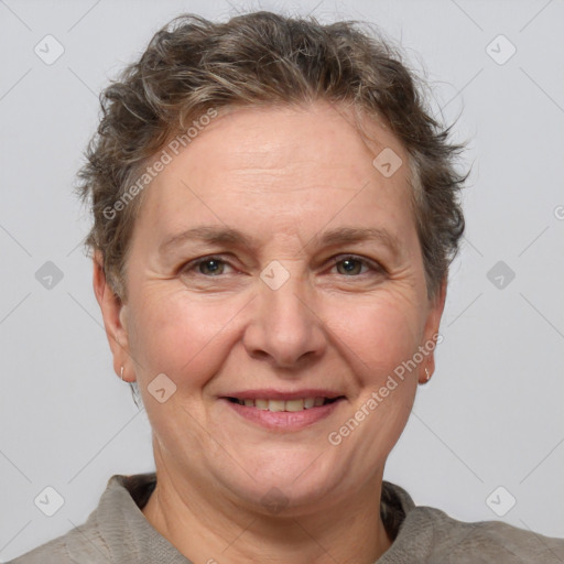 Joyful white adult female with short  brown hair and brown eyes