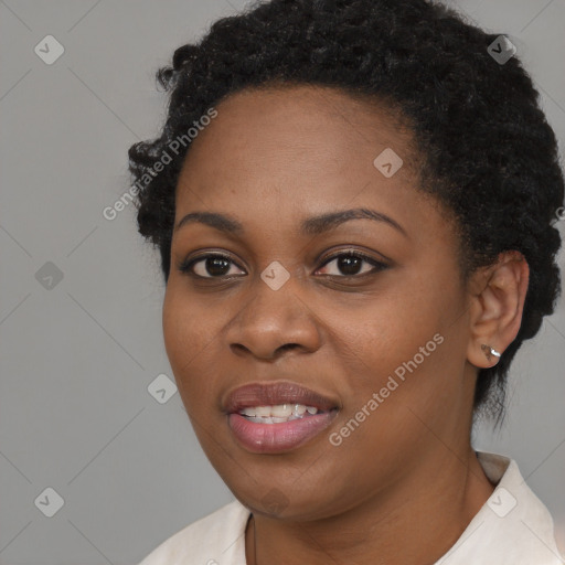 Joyful black young-adult female with short  black hair and brown eyes