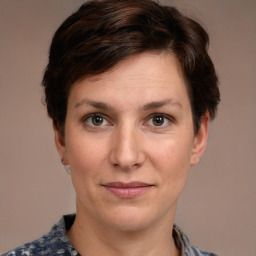 Joyful white adult female with short  brown hair and brown eyes