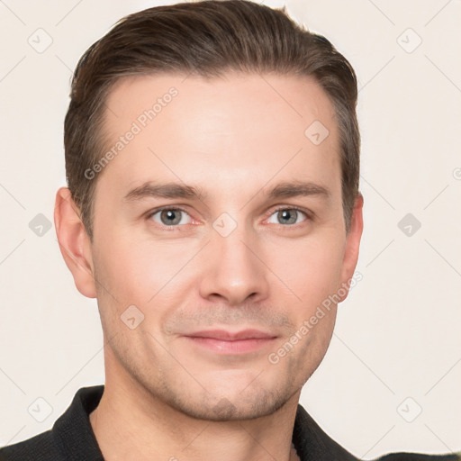 Joyful white young-adult male with short  brown hair and grey eyes