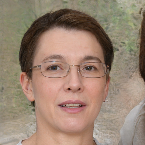 Joyful white adult female with short  brown hair and brown eyes