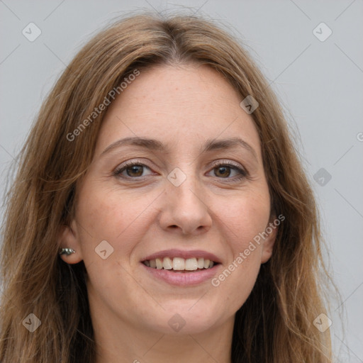 Joyful white adult female with long  brown hair and grey eyes