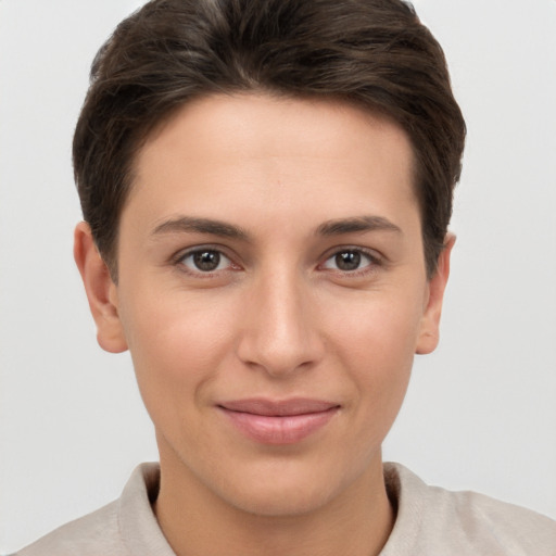 Joyful white young-adult female with short  brown hair and brown eyes