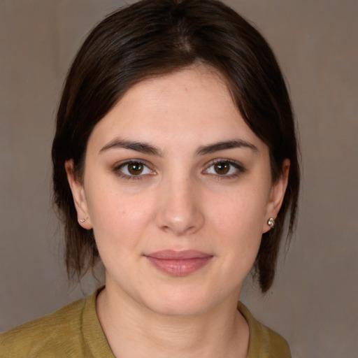 Joyful white young-adult female with medium  brown hair and brown eyes