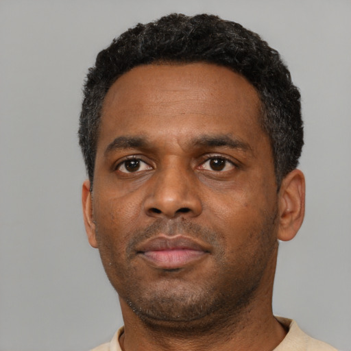 Neutral black young-adult male with short  black hair and brown eyes