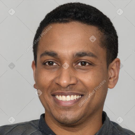 Joyful latino young-adult male with short  black hair and brown eyes