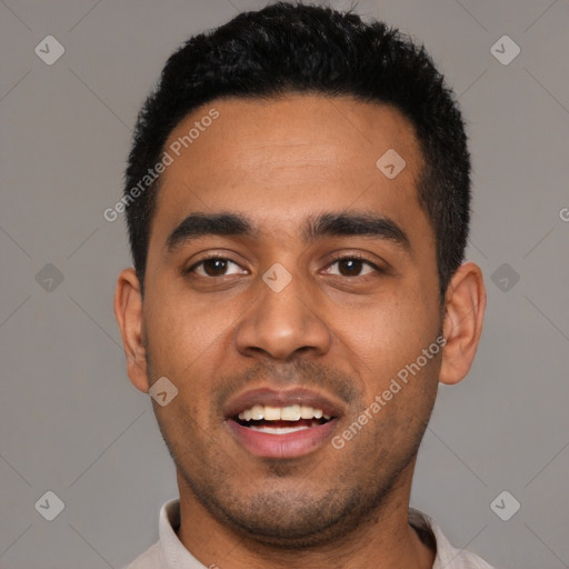 Joyful latino young-adult male with short  black hair and brown eyes